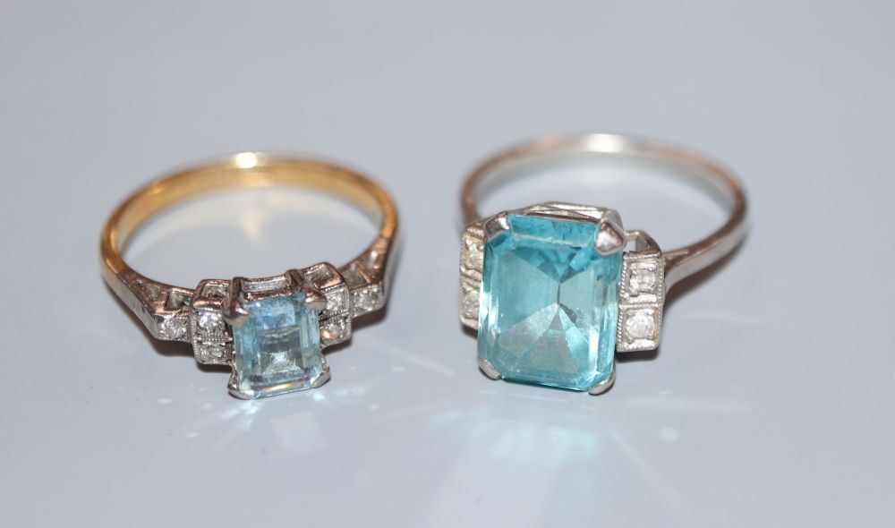 A white metal (stamped plat), blue zircon and diamond set dress ring, size L/M & an aquamarine & diamond ring.